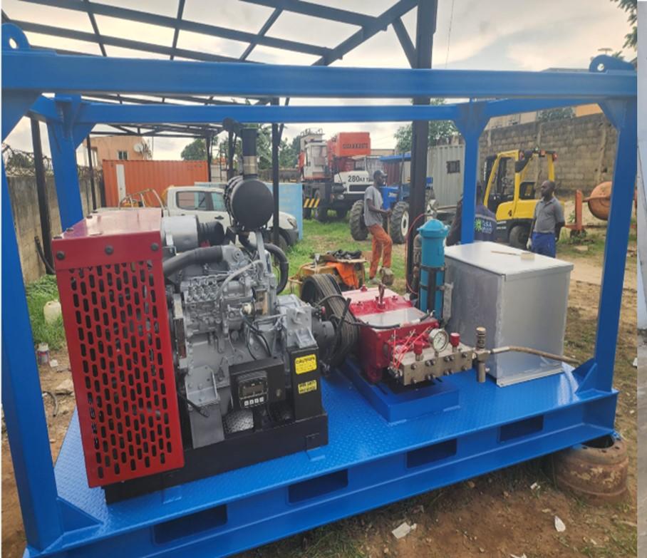 High-pressure pump skid on blue steel frame